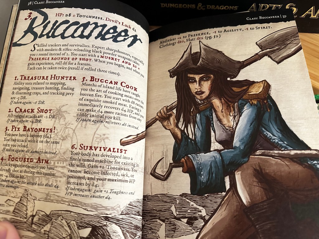 A photo of the two-page spread for the Buccaneer class in the Pirate Borg core book. The illustration on the second page shows a femme person wearing pirate gardb, including a tricorm hat. They have a hook instrad of a left hand and have a spade slung over the right shoulder.