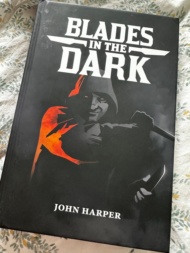 The cover of Blades in the Dark