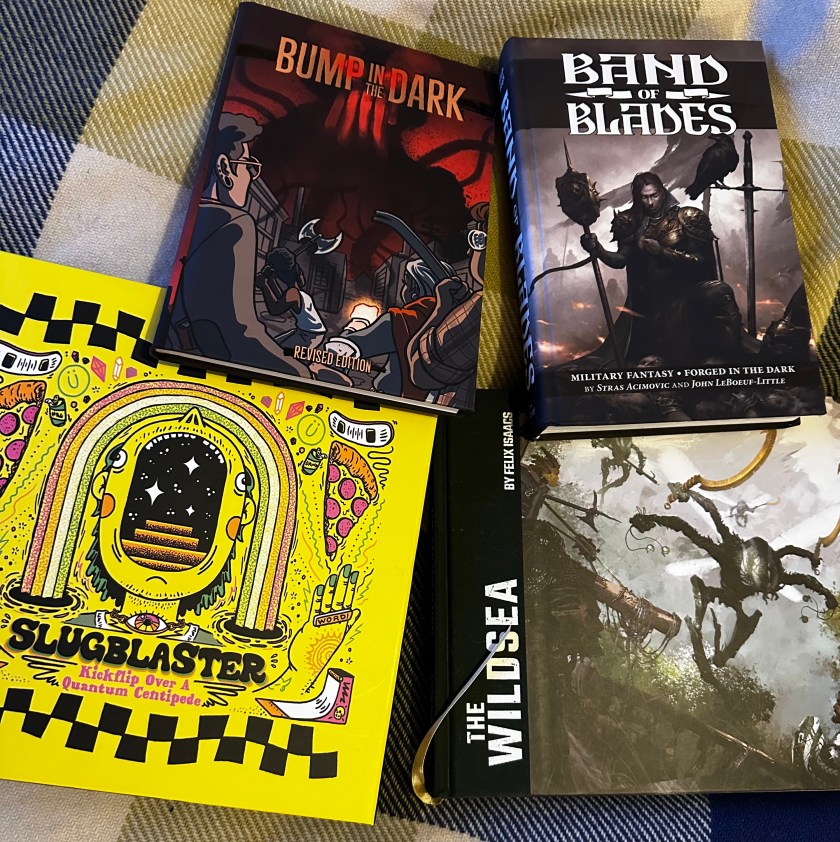 From top left, clockwise, the covers of Bump in the Dark, Band of Blades, The Wildsea and Slugblaster