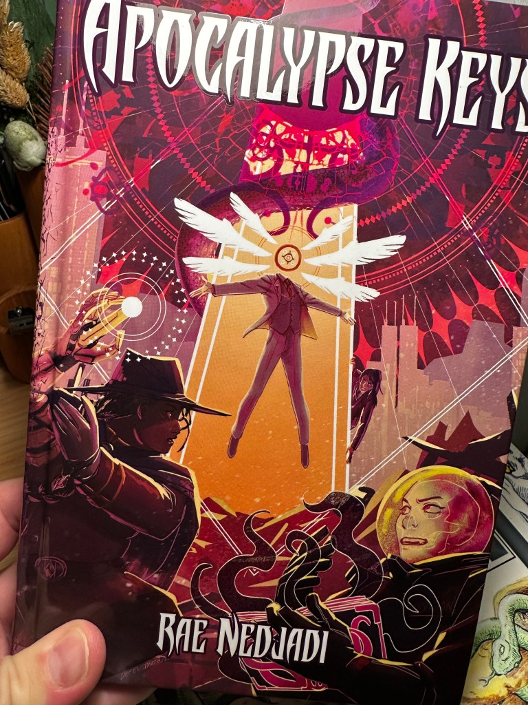 The cover of Apocalypse Keys shows a trio of Omens defending against a humanoid with one eye six wings and a suit.