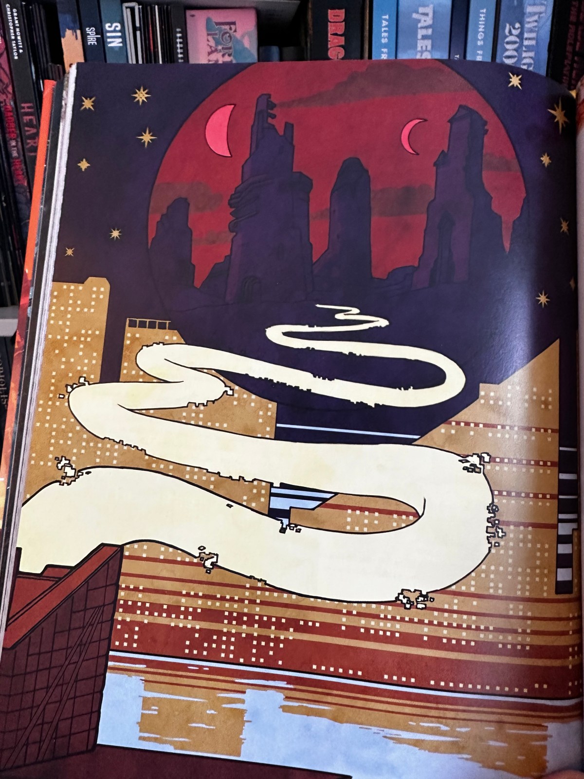 The illustration for the Bridge Maiden Part 2. A winding bridge of yellow light leads from the real world Tokyo into the red sky and alien architecture of Carcosa with its two moons.