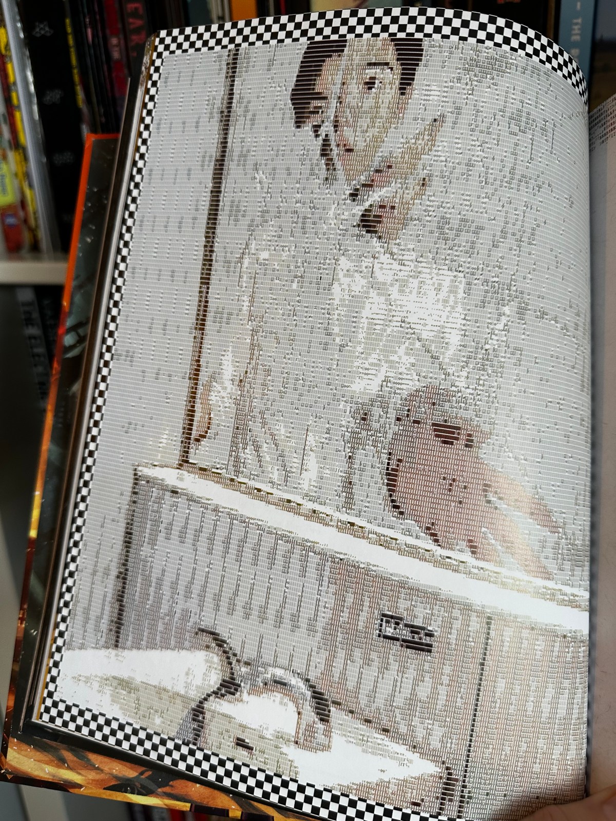 A pixelated image of the broken refelction of a teenaged Japanese boy in a broken bathroom mirror. His hand reaches towards the glass.