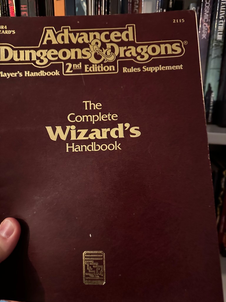 Cover of the Complete Wizard's Handbook for AD&D 2e. It is wine in colour.