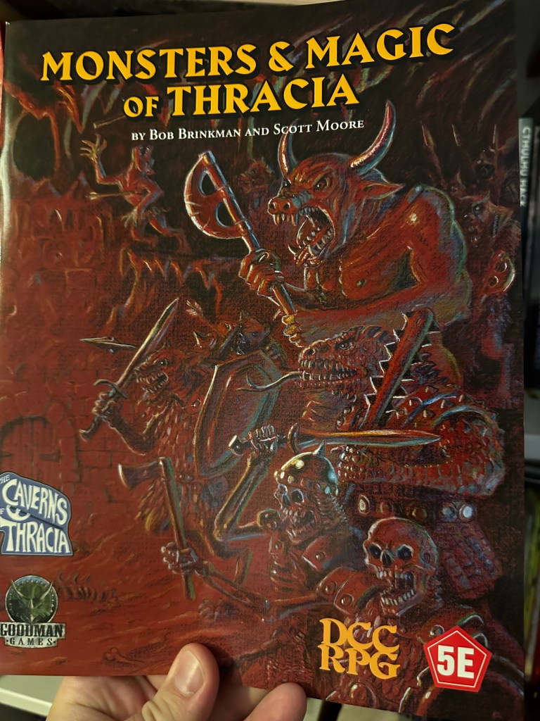 The cover of Monsters & Magic of Thracia. it is very brown and depicts a number of monsters including a minotaur, a couple of skeletons, a lizard man and what I think are kobolds.