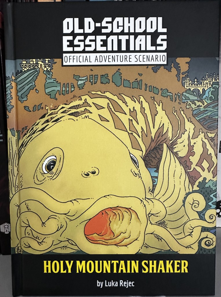 Cover of Holy Mountain Shaker by Luka Rejec - massive yellow fish under the landscape.
